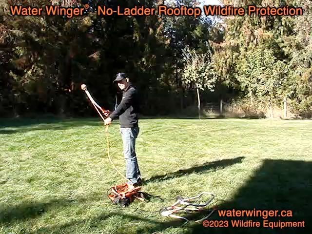 Ball chucker placing a Water Winger deployment line over a roof