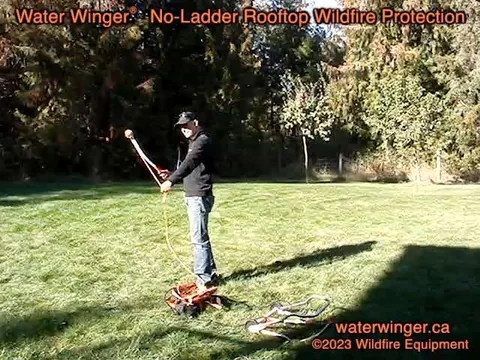 Ball chucker placing a Water Winger deployment line over a roof